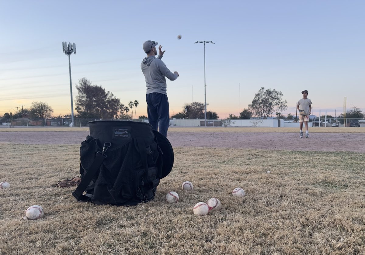 A coach tosses a ball to a player during Western Little League practice at Joaquin Murrieta Park on Jan. 27, 2026, in Tucson, Ariz. Western Little League opening ceremonies and first games were on Saturday March 28, 2026.

